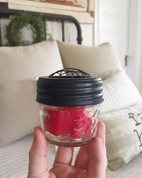 Diy Car Air Freshener Pop A Few Wax Melts In A Mason Jar With Some Holes In The Lid Place In Your Cupho Car Air Freshener Diy Air Freshener Car Car