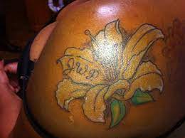 Yellow Lilly Tattoo On Darker Completion I Love How The Yellow Is So Brilliant On This Skin Tone Done By Tom Hacic Yellow Tattoo Lillies Tattoo Iris Tattoo