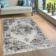 Composed of pieces of 50 years old oriental carpets, new coloured and arranged. Designer Teppich Vintage Look Grau Teppichcenter24