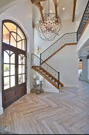 The hallway is kept dark with dim lights and a deep this foyer is designed to give a view of the entire house proudly. Pin By Joy Drake On Floored House Design Stairs Design Home