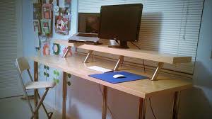 This simple standing height desk is made from a reclaimed door and styled sawhorses. Build A Diy Wide Adjustable Height Ikea Standing Desk On The Cheap