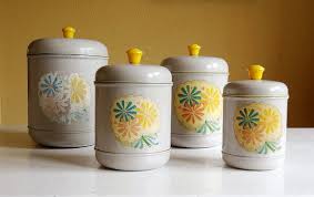 Get 5% in rewards with club o! Reserved For L Vintage Canister Set 4 Kitchen Storage Containers Warm Grey And Yellow With Retro Flower Decals Vintage Canister Sets Vintage Canisters Canister Sets
