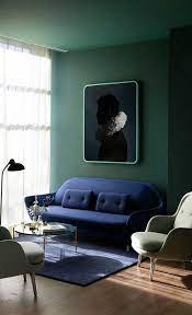 Classy Blue Piece Floating In A Dark Green Wall Wood Tailors Club Living Room Green Interior Design Green Rooms