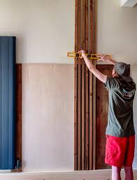 How to diy a vertical wood slat wall. Building A Diy Vertical Wooden Slat Wall Our Crafty Home