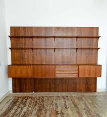31.5 wide x 18 deep x 20.5 inches high ello mid century teak chrome and smoked glass 4 bay freestanding wall unit price $2,495 Large Mid Century Design Nutwood Poul Cadovius Wall Unit Denmark 1960s Hpvintage Com