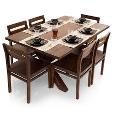 It's crafted entirely from reclaimed walnut and it has a simple and ingenious design. Clovis Barcelona 6 Seater Dining Table Set Thearmchair