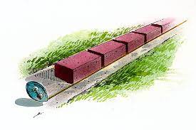 If you have a sloping garden, level it off with a retaining wall constructed of stacked bricks. Brick Raised Bed Better Homes Gardens