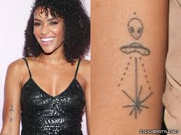Aliens flying a spaceship is a great suggestion if you want to keep the stars and planets look but add a little bit of life to the image. Celebrity Spaceship Tattoos Steal Her Style