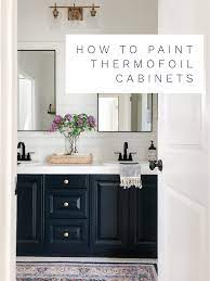 Photo of a nautical bathroom in boston with shaker cabinets, medium wood cabinets, an alcove bath, a shower/bath combination, blue tiles, white tiles, white walls, a submerged sink, beige. How To Paint Thermofoil Cabinets A Thoughtful Place