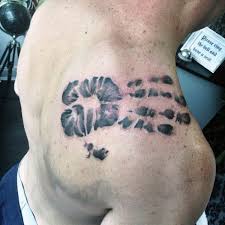 Charlie baby footprint tattoo on chest. 60 Handprint Tattoo Designs For Men Impression Ink Ideas