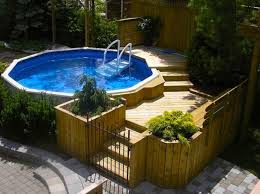 17 Ways To Pretty Up An Above Ground Pool Aboveground Hgtv Pool Prettyup Ways Ding In 2020 Schwimmbaddecks Hinterhof Pool Landschaftsbau Schwimmbad Designs