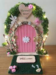 Designer jaimee rose took her household's fairy doors in a very chic direction with classical pediments, brass details, and classic hues. Pin On Erin Memorial Bench