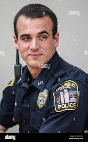 In this Monday, April 17, 2017 photo, Columbus Police officer Tony Kummer  listens as Paula Arnold talks about how grateful she is for the response  from Columbus Police Department to rescue her