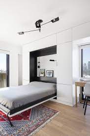 Photo 10 Of 18 In An Iconic T Shaped Apartment Receives A Modern Hideaway Bed Apartment Renovation Living Room Sofa