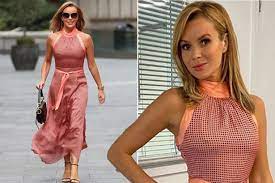 The comments on the post are flooded with fire emojis and hearts. Amanda Holden Braves The Cold As She Gets Caught In The Wind In Curve Clinging Dress Irish Mirror Online