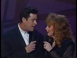 Reba McEntire and Vince Gill perform The Heart Won't Lie in 1993 | Center  Stage Magazine | Facebook