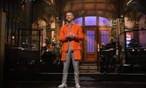Saturday Night Live Mckinnon S Fauci Gives Americans Chance To Vie For Vaccine Eligibility Saturday Night Live The Guardian