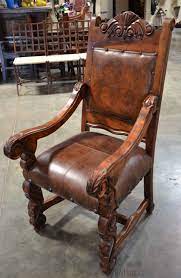 A carved arm chair with down blend filled seat cushions that are reversible for a longer wear. Wood Carved Arm Chairs Ideas On Foter