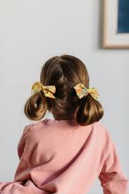 Long knots hairstyle watch the video tutorial showing how to do this hairstyle. 3 Easy Hairstyles For Kids Braids Buns And Wavy Hair The Effortless Chic