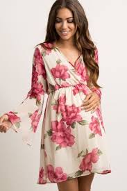 A Floral Chiffon Maternity Dress Featuring A Wrap V Neckline Semi Sheer Long Bell Sleev Maternity Wrap Dress Chiffon Maternity Dress Floral Maternity Dresses