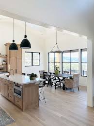 Black And White House Interior Kitchen Modern Farmhouse Dining Room With Black Steel Windows Walls In Benjamin Moore Simply White And White Modern Farmhouse Dining Room Modern Farmhouse Dining Home