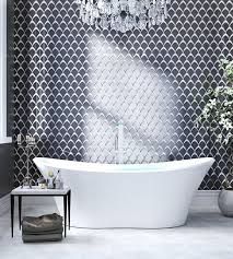 This contemporary bathroom has been expertly infused with a gentle spa atmosphere and a lot of that has to do with the clean white bathroom mosaic tile designs placed throughout. The Top Bathroom Tile Trends For 2021
