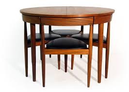 All Tucked In Hans Olsen S Super Space Saving Dining Set Space Saving Dining Table Small Space Dining Set Dining Table Chairs