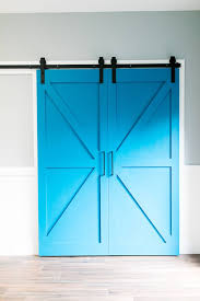 Barn door in interior design. How To Build A Barn Door On A Budget Laura Fuentes