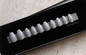 So, here we are showing you how extremely well it collaborates with both short and longs nails. Glossy Grey Coffin Nails Nhq London