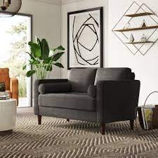 Crafted from solid and manufactured wood, it stands atop splayed legs and features a streamlined silhouette wrapped in linen upholstery. Mercury Row Garren Sofa Wayfair