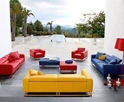 The Red Couch And Chairs Blue Couch And Yellow Couch Give This Space A Triadic Color Scheme Colorful Sofa Living Room Colourful Living Room House Design