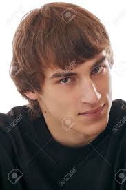 There are other races of people that we may think should have a certain skin color, hair or eye color. Head And Shoulders Portrait Of Smiling Teenage Boy Brown Hair Gray Eyes Gray Hooded Sweater Direct Gaze Dark Background Vertical Format Stock Photo Picture And Royalty Free Image Image 14570372