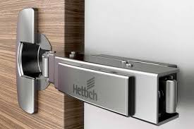 The cabinet door features a beveled mirror and opens to reveal a mirrored cabinet within, with three adjustable glass shelves. Hinges Hettich