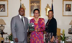 Dr. Leon Higgs Presents a Copy of his Book to the Governor General