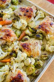 One Pan Chicken With Cauliflower Brussels Sprouts And Carrots Recipe Sheet Pan Dinners Recipes Sheet Pan Recipes Chicken Brussel Sprouts
