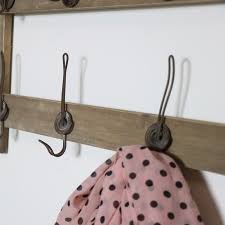 Rustic pine wood wall shelf display with peg hooks & sliding doors, 3 shelves. Rustic Wooden Wall Shelf With Hooks