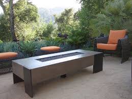Unique Ebel Patio Furniture Design With Cozy Chair And Ottomans Near Teak Table Near Lush Plants Fire Pit Table Concrete Fire Pits Fire Pit Seating