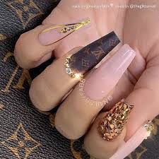 Sheer Milky Pink Lv Decal Gold Glitter And Crystals On Long Coffin Nails Nail Artis Coffin Nails Long Coffin Nails Designs Mauve Nails Handemade louis vuitton waterslide nail decals with accents of gold lv's and swarovski crystals.