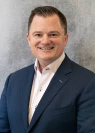 Corey M Caron, Managing Director