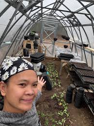 My messy greenhouse so far. Planted flower seeds, tomatoes, peppers
