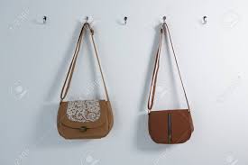 Let's start with single hooks. Stylish Handbags Hanging On Hook Against Wall Stock Photo Picture And Royalty Free Image Image 89186811
