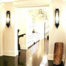 If you are going higher, just be sure to consider the window frame height. Hallway Sconce Lighting Hallway Sconces Interior Wall Sconces Wall Lamps Bedroom