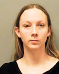 Woman charged in stabbing