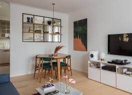Create an open living room with a classic interior wrapped in a simple color combination of white and brown. Before After Contemporary Apartment Gets A Mid Century Modern On Dwell
