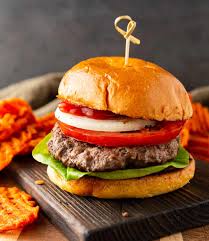Big, juicy bison burgers are cooked in a cast iron skillet for a delicious crust, covered with melty cheese and your favorite toppings. Bison Burgers Basil And Bubbly
