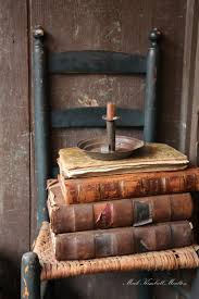 A Chair Books And Hogscraper Candlestick Antique Books Old Books Vintage Books