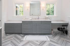 In this bathroom, the round bathtub is clearly the centerpiece. Gray Bathroom With Gray Marble Herringbone Floor Tiles Contemporary Bathroom