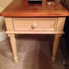 This rectangular shaker style table features breadboard ends, the thin strips on the tabletop with the wood grain going in the opposite direction. Find More 2 Broyhill Side Tables In Antique Cream Body Oak Top Beautiful Sturdy Solid Wood See Comments Tops Need Sanding Restain 25 Yrs Old For Sale At Up To 90 Off