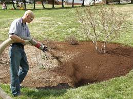 What is the best tool for spreading mulch? How To Use Mulch In Landscaping The Blue Collar Blogger