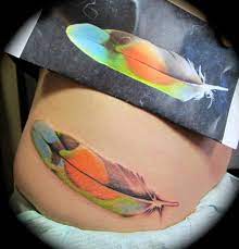 Beautiful Peach Faced Lovebird Tail Feather Artist Nick Sage At Oc Tattoo Garden Grove California Feather Tattoo Colour Tattoos Feather Tattoos